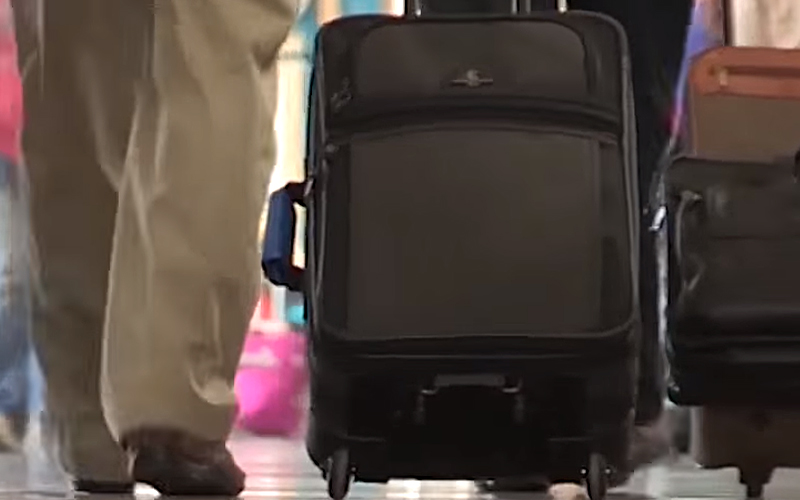 Ergonomic Strategies for Using a Suitcase