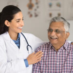 Cheerful,Geriatrician,Woman,And,Old,Indian,Patient,Laughing,In,Clinic