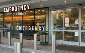 Front door of Valley Medical Center Emergency Department with sign that says "Emergency"