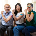 Senior,Asian,Couple,And,Young,Woman,Get,Vaccinated,With,Bandage