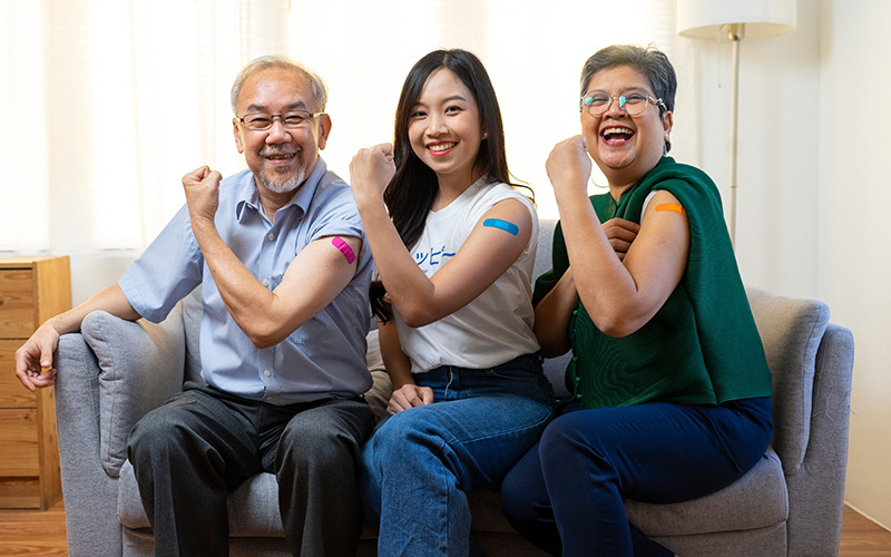 Senior,Asian,Couple,And,Young,Woman,Get,Vaccinated,With,Bandage