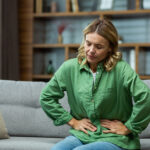 An,Elderly,Woman,Is,Sitting,On,The,Sofa,At,Home,