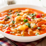 Italian,Minestrone,Soup,On,White,Wooden,Background.,Selective,Focus.